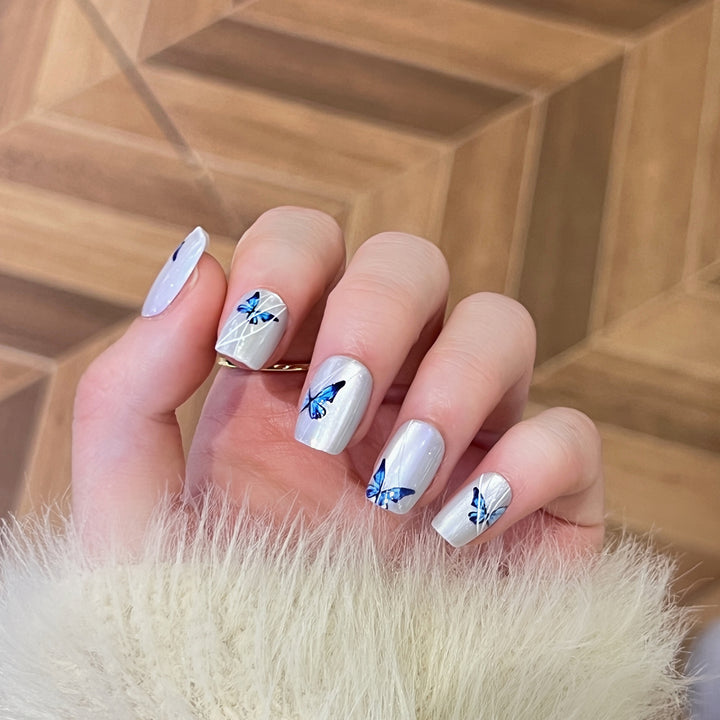 Creative nail extensions with intricate butterfly design Bowlift