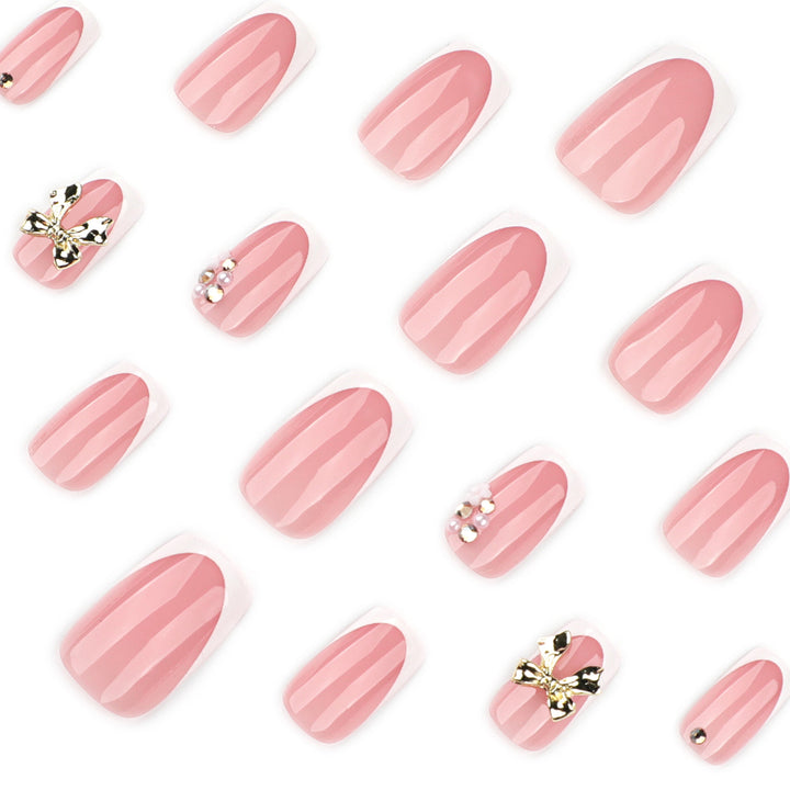 Elegant Nail Extensions with French Tips and Decorative Accents Bowlift