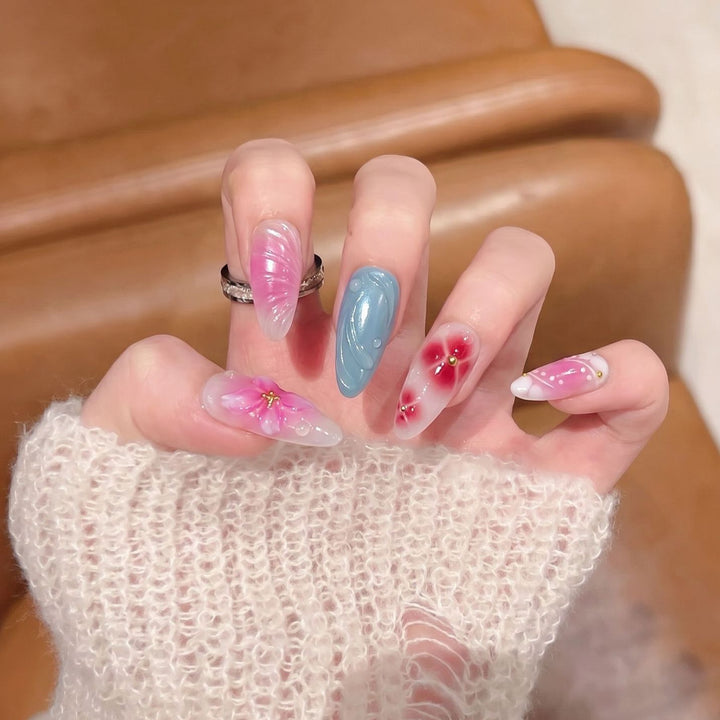 Artistic Press-On Nail Set with Floral and Abstract Designs Bowlift