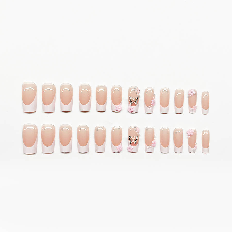 Artificial nail set with playful 3D flowers and glitter accents Bowlift