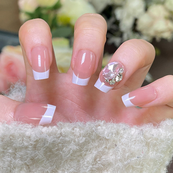 Elegant French Tip Press-On Nails with Decorative Rhinestone Accent Bowlift