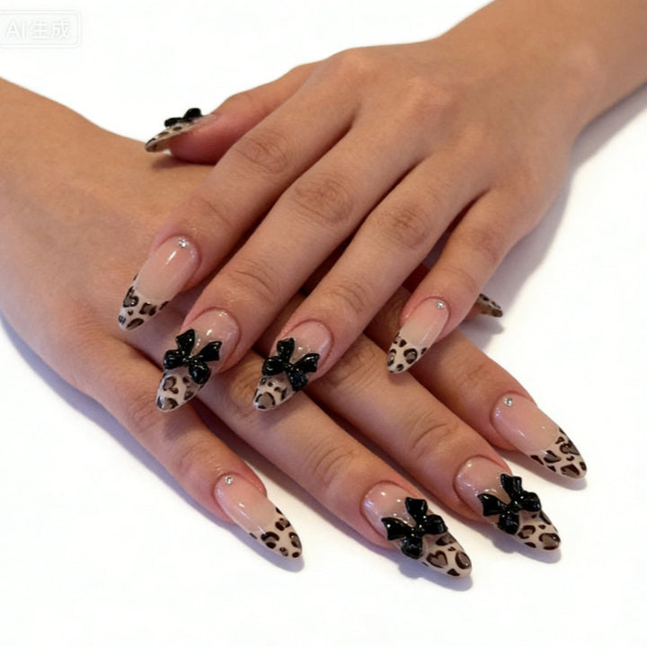 Creative artificial nails with stylish leopard pattern and bow accents Bowlift
