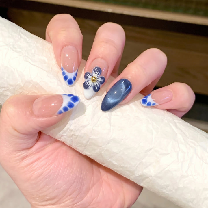 Artistic Press-On Nail Set with Floral and Geometric Accents Bowlift
