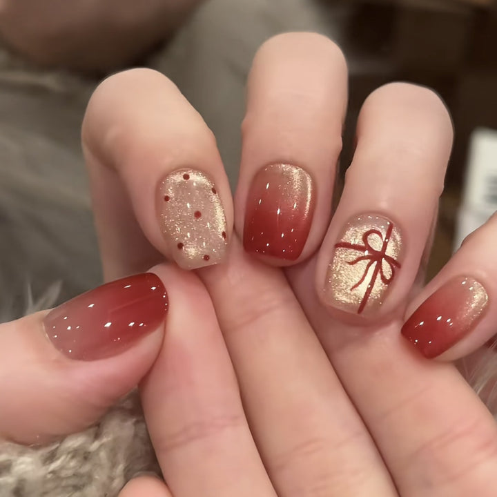 Artificial nails with festive gradient color and elegant decorations Bowlift