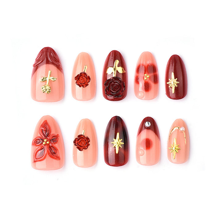 Artificial nail set with elegant floral applications and glamorous accents Bowlift