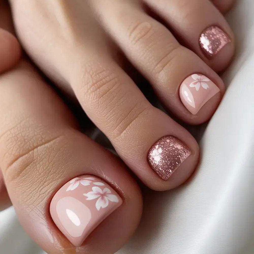 Fingernail art set with elegant floral design and glitter accents Bowlift