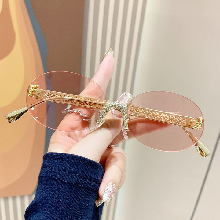 Women's sunglasses with glittering frame and oval lenses Bowlift