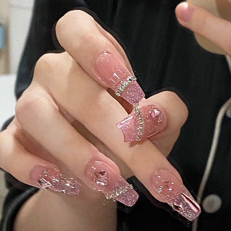 Artificial nails with heart design and glitter accents Bowlift