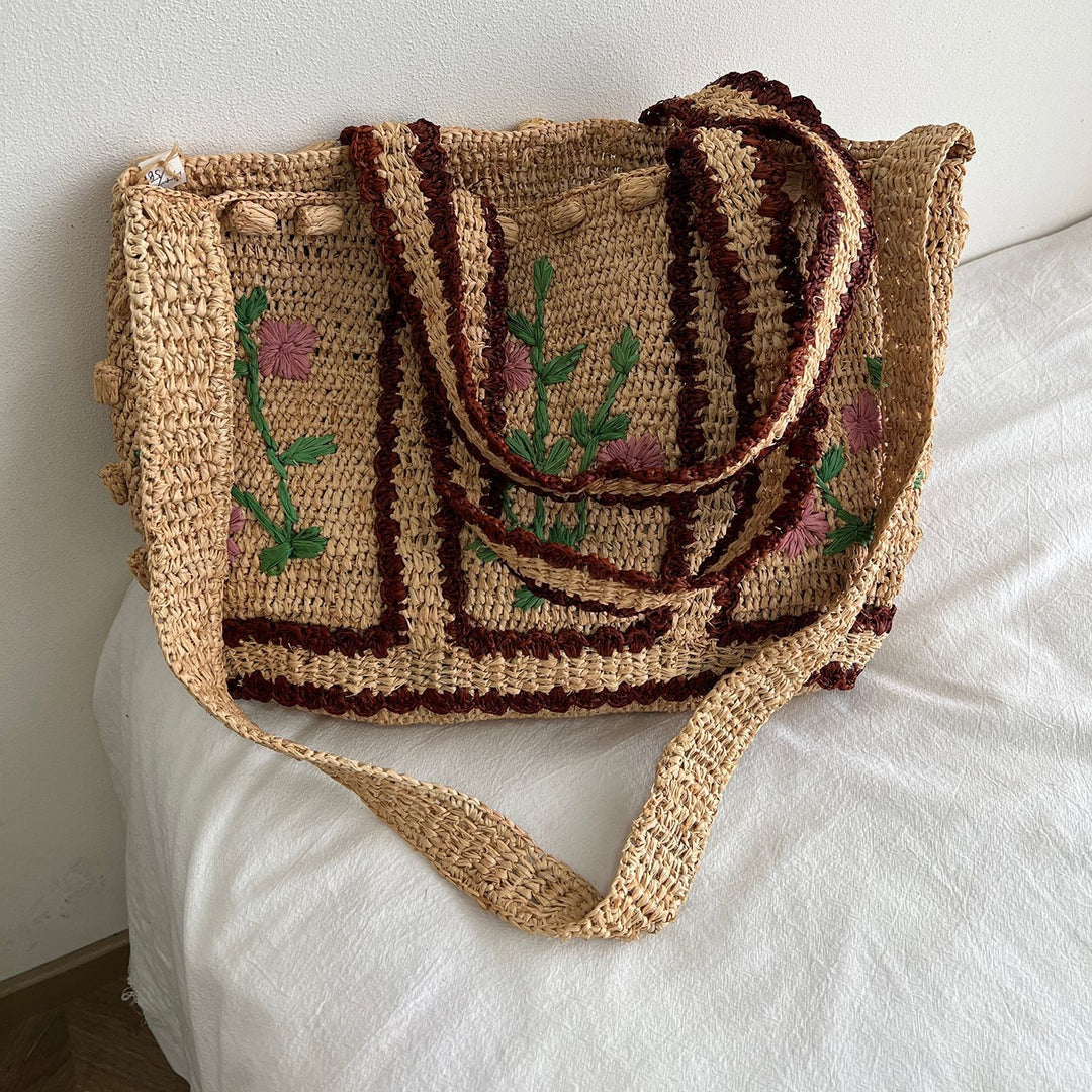 Braided shoulder bag with floral motif Bowlift