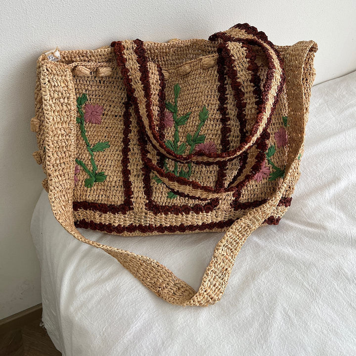 Braided shoulder bag with floral motif Bowlift