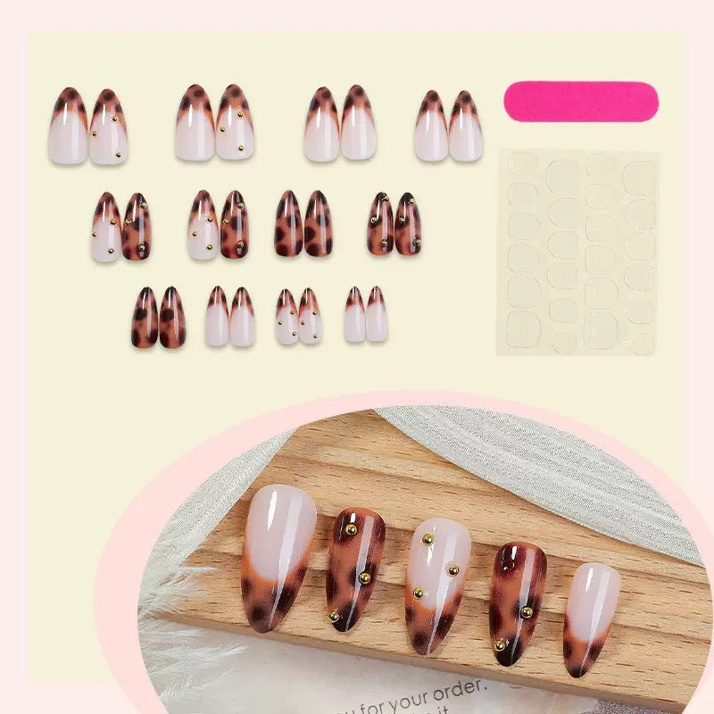 Acrylic nail set with luxurious leopard pattern and golden accents Bowlift