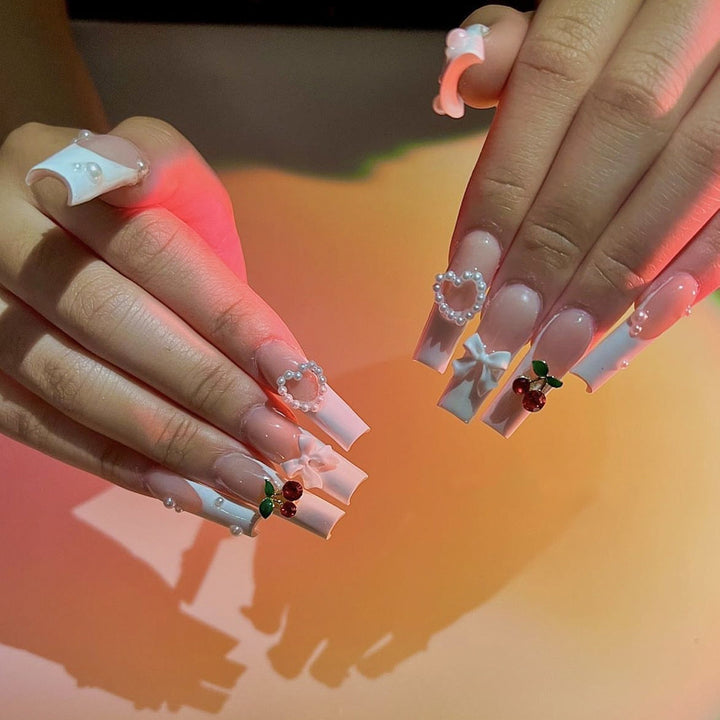 Artificial nail set with elegant 3D decorations and pearl accents Bowlift