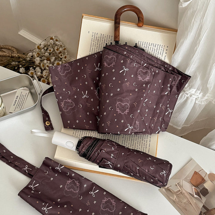 Women's folding umbrella with elegant pendant design Bowlift