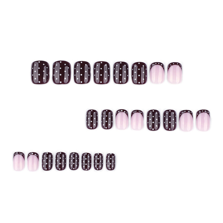 Artful nail art with elegant polka dot design Bowlift
