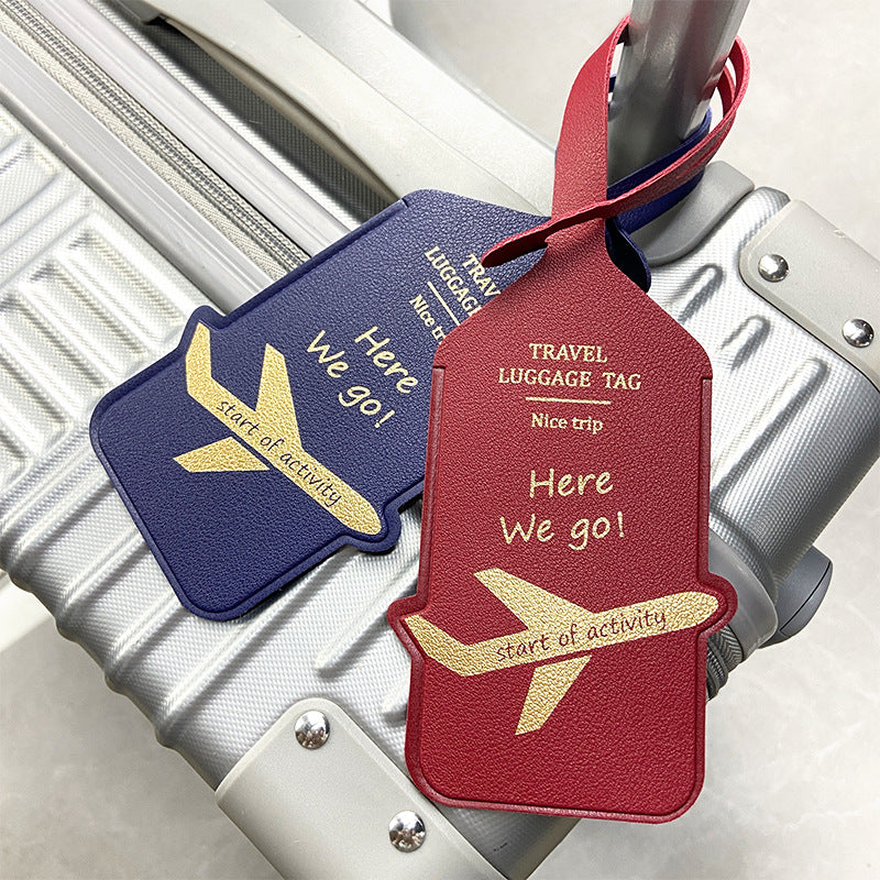 premium leather travel luggage ID tag with embossed airplane motif and adjustable strap Bowlift
