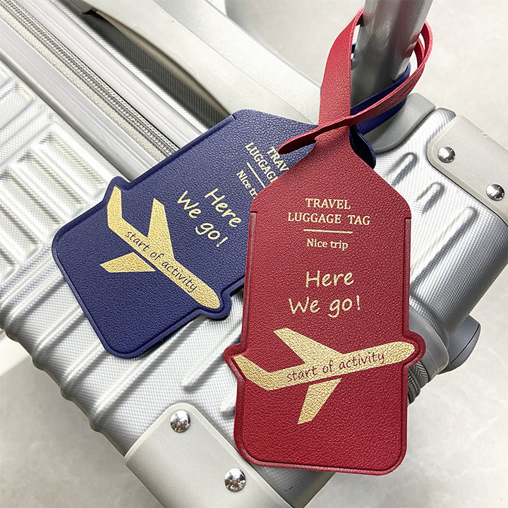 premium leather travel luggage ID tag with embossed airplane motif and adjustable strap Bowlift