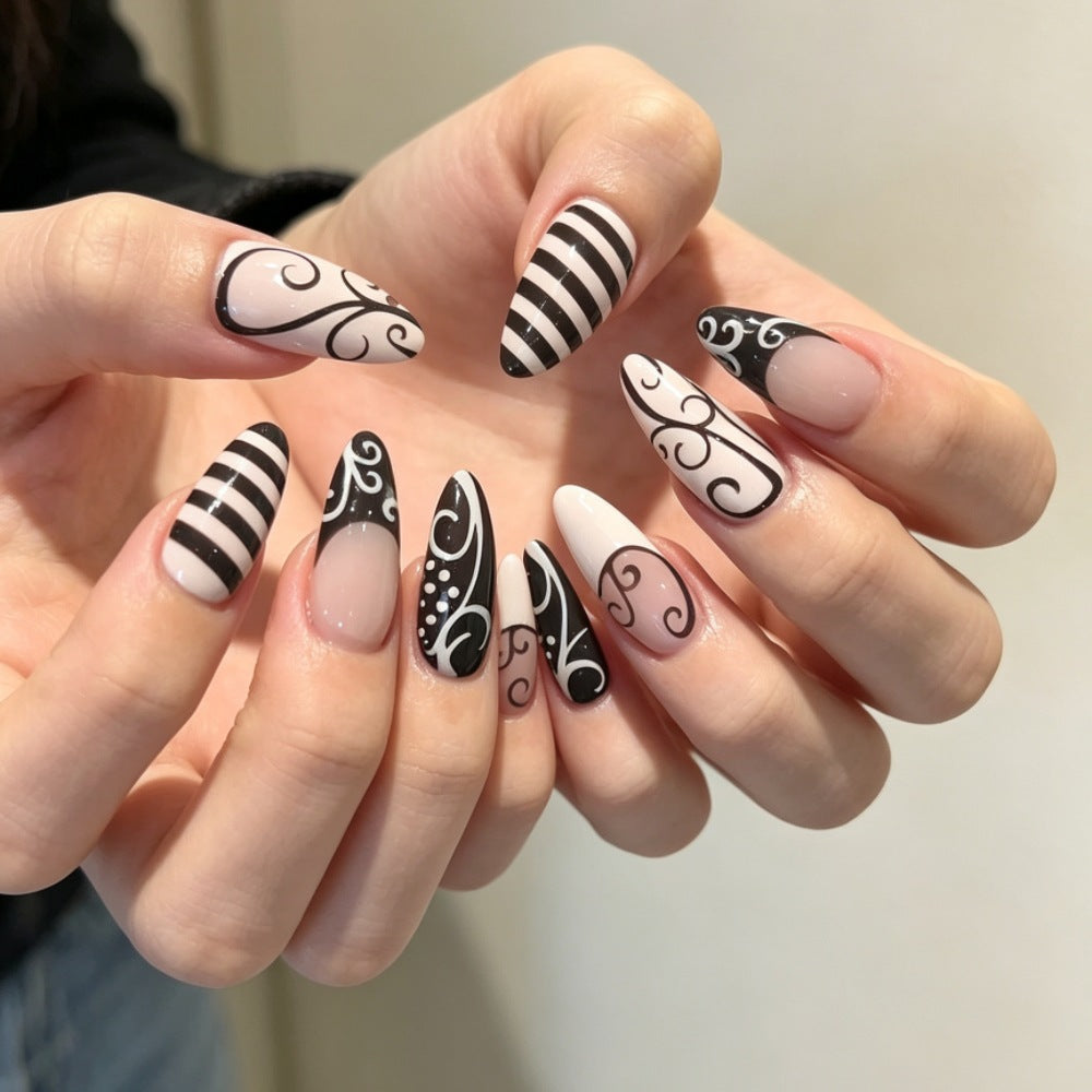 Artistic Stiletto Press-On Nails with Intricate Patterns Bowlift