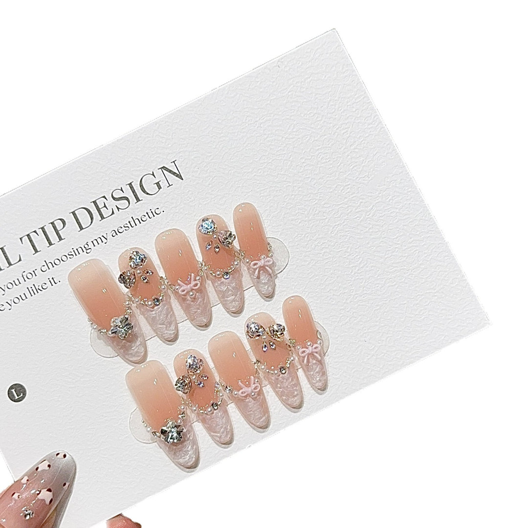 Artificial nails with romantic rhinestone details Bowlift