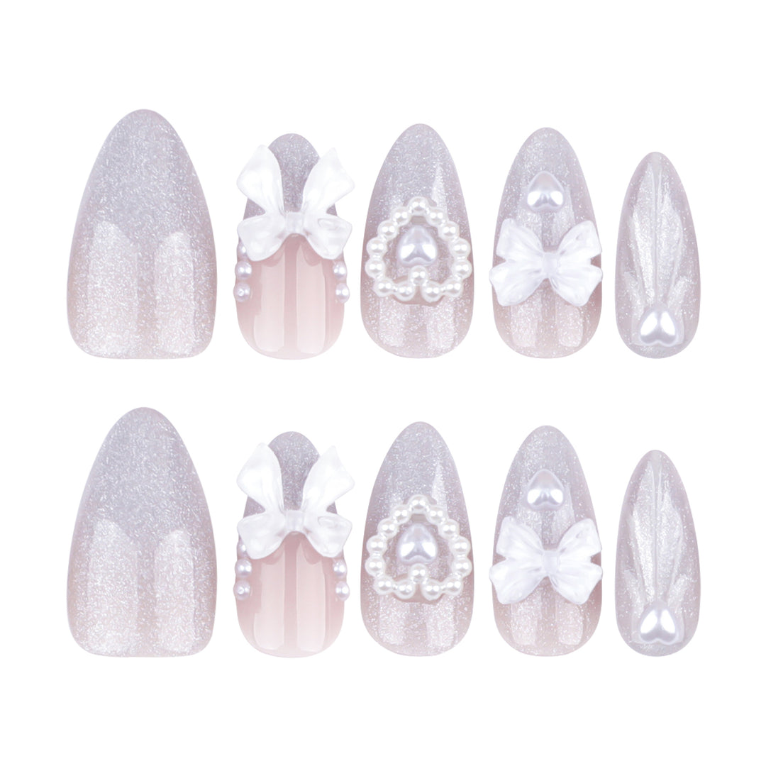 Artful nail decoration with pearl and bow accents Bowlift