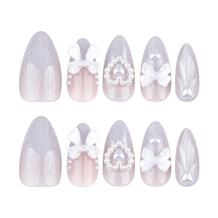 Artful nail decoration with pearl and bow accents Bowlift
