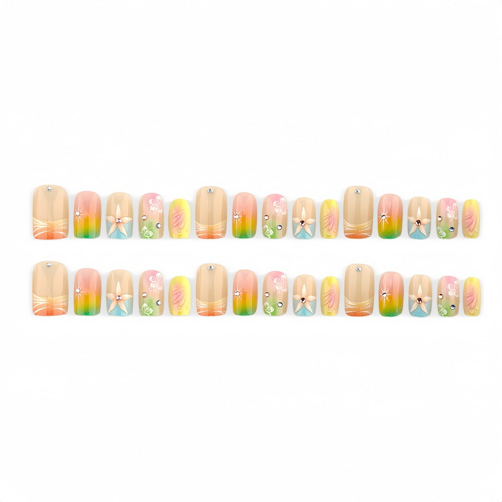 Acrylic nails with floral accents and gradient Bowlift