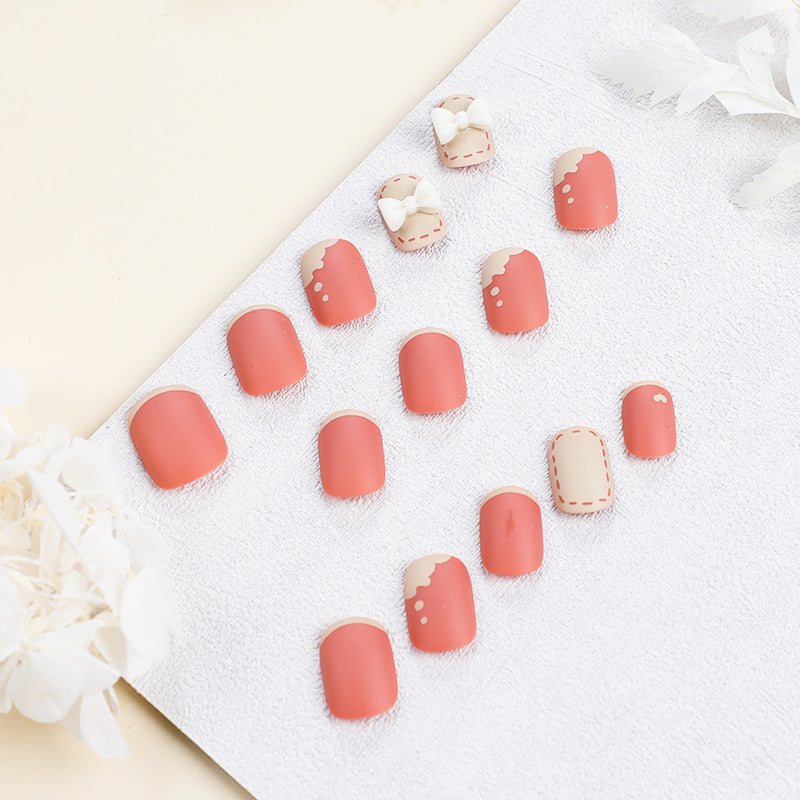 Artistic nail nails with decorative bow designs and French tips Bowlift