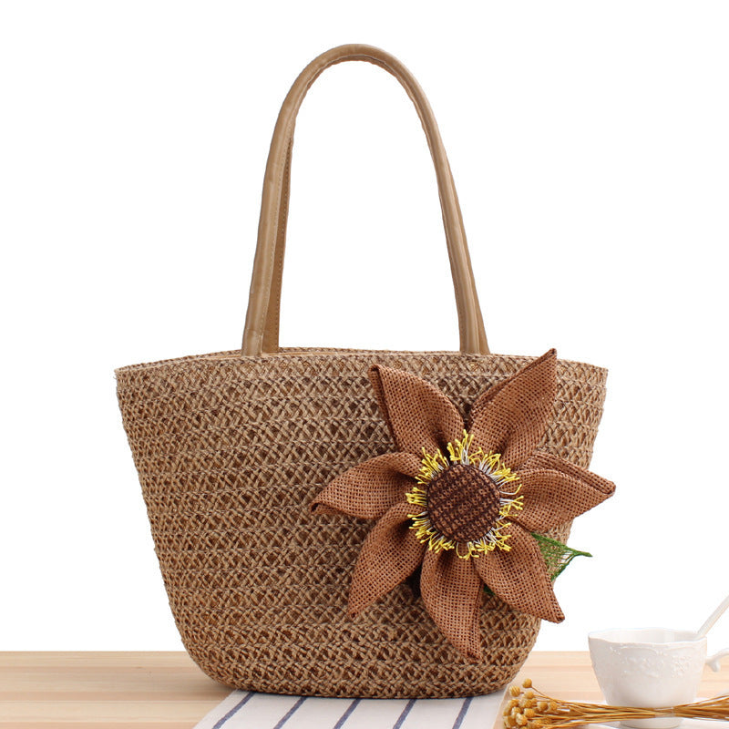 Handbag with floral appliqué Made of natural material Bowlift