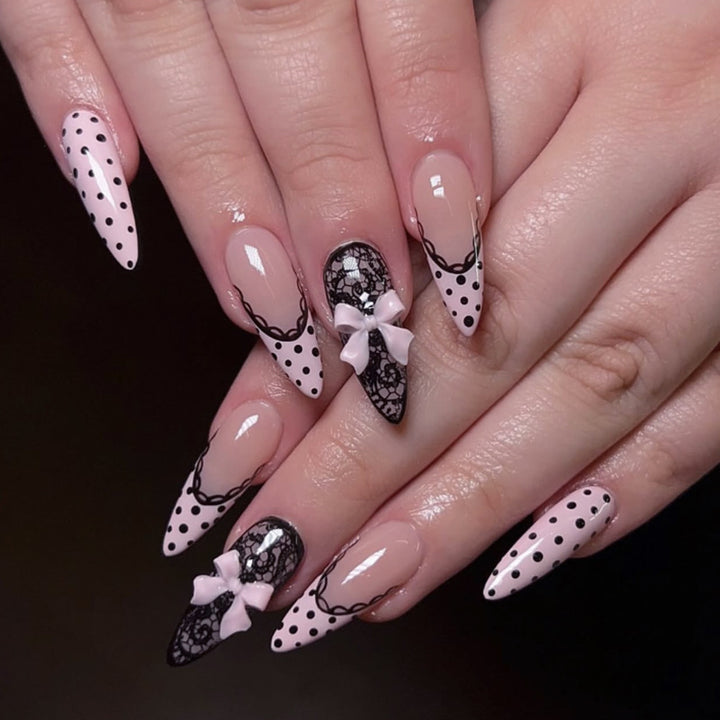 Artful stiletto nails with elegant floral design and glitter details Bowlift