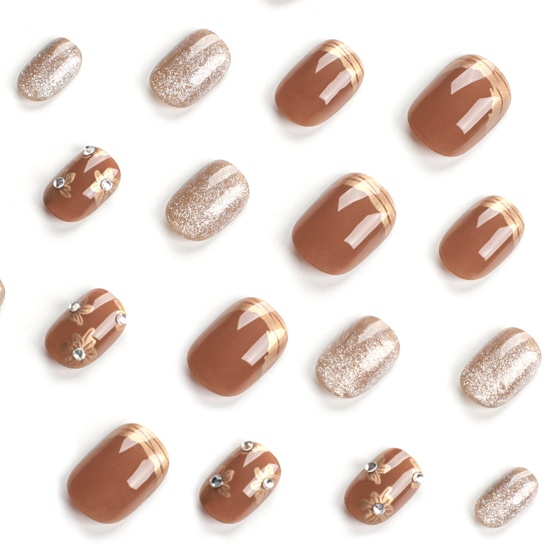 Elegant Nail Decoration with Glitter and Floral Accents Bowlift