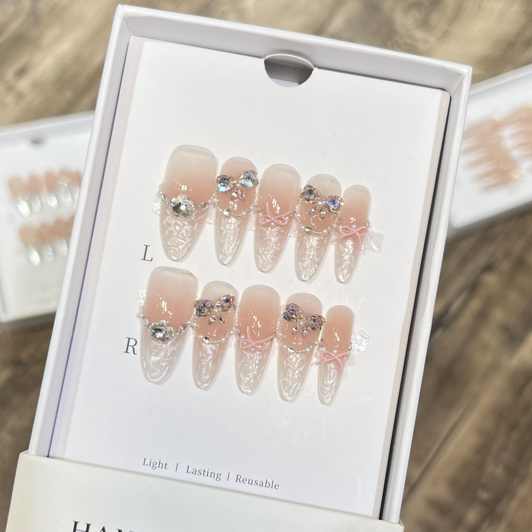 Decorative Stiletto Press-On Nail Set with Bow and Gem Accents Bowlift