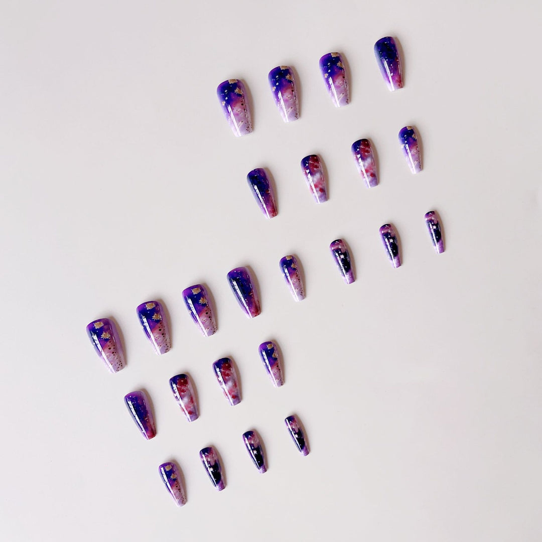 Glittering artificial nail tips in galaxy design Bowlift