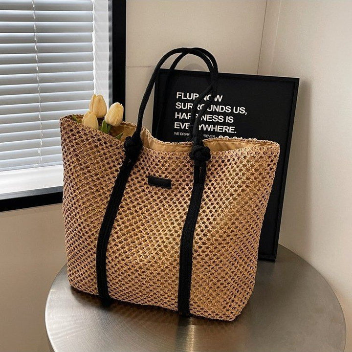 Beach bag made of hand-woven natural material with sturdy handles Bowlift