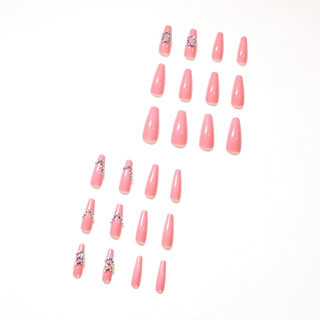 Artificial nail extensions with elegant rhinestone embellishments Bowlift