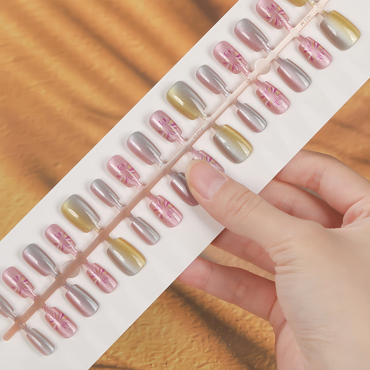Artificial nails in modern ombre design with floral accents Bowlift