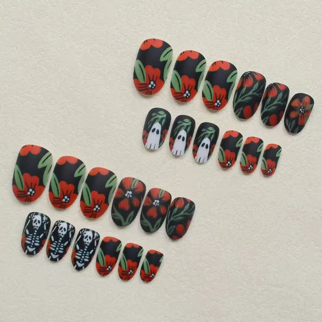 Acrylic nail set with creepy Halloween designs and floral accents Bowlift