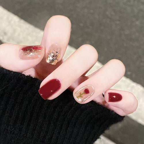 Elegant nail design with floral and sparkling accents Bowlift