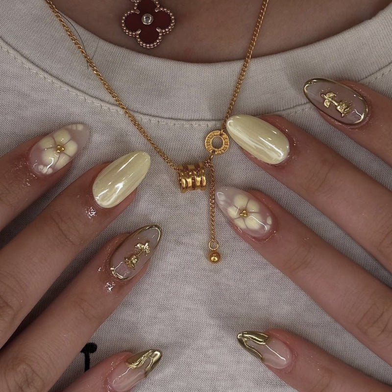 Artful nail art with floral decorations and glitter accents Bowlift