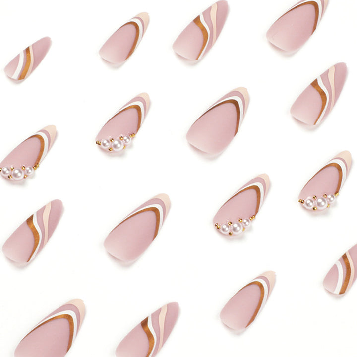 Artful stiletto nails with elegant gold and white accents Bowlift
