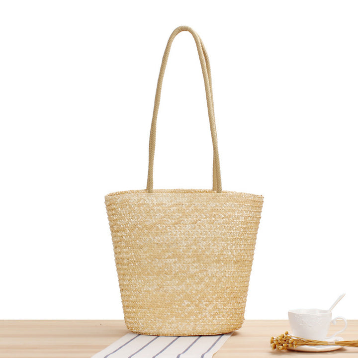 Shoulder bag made of braided natural material with long shoulder straps Bowlift