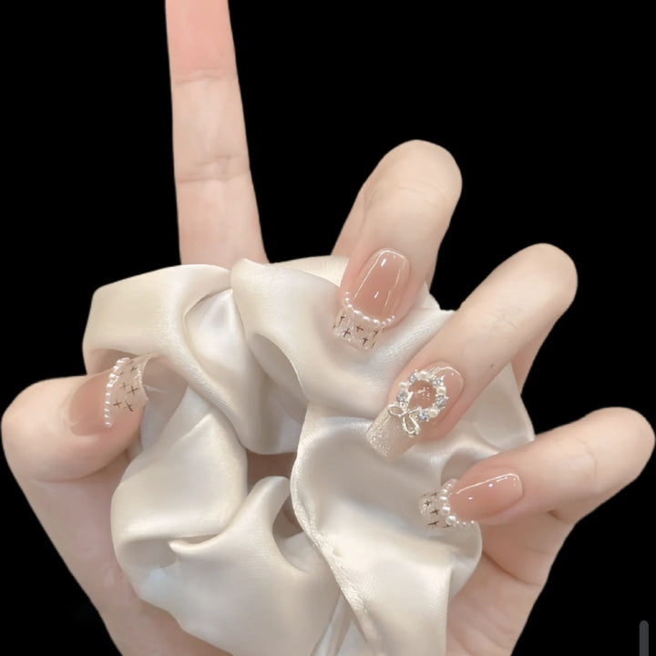 Glamorous artificial nails with sparkling decorations Bowlift