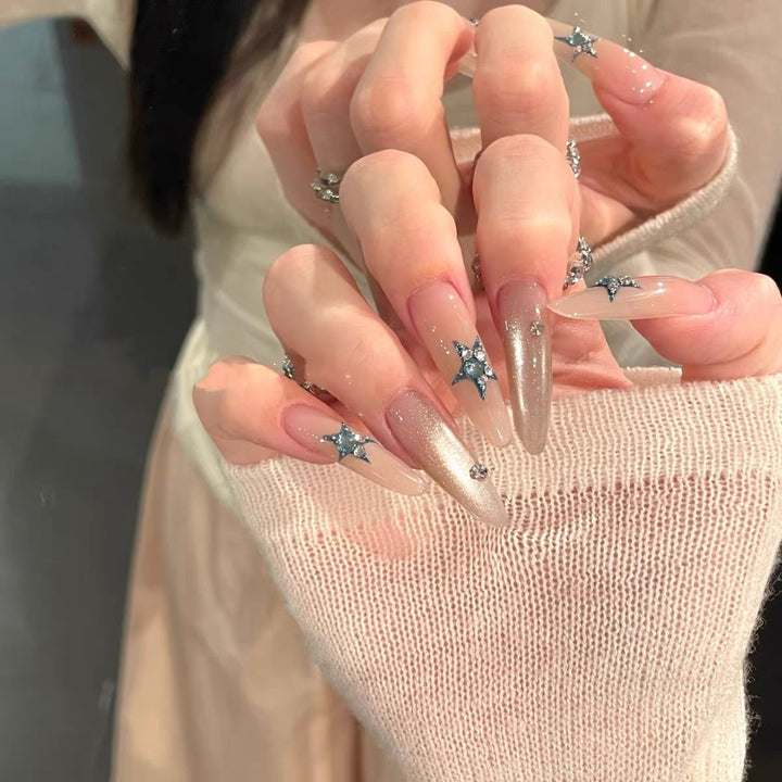 Glamorous artificial nails with star accents Bowlift