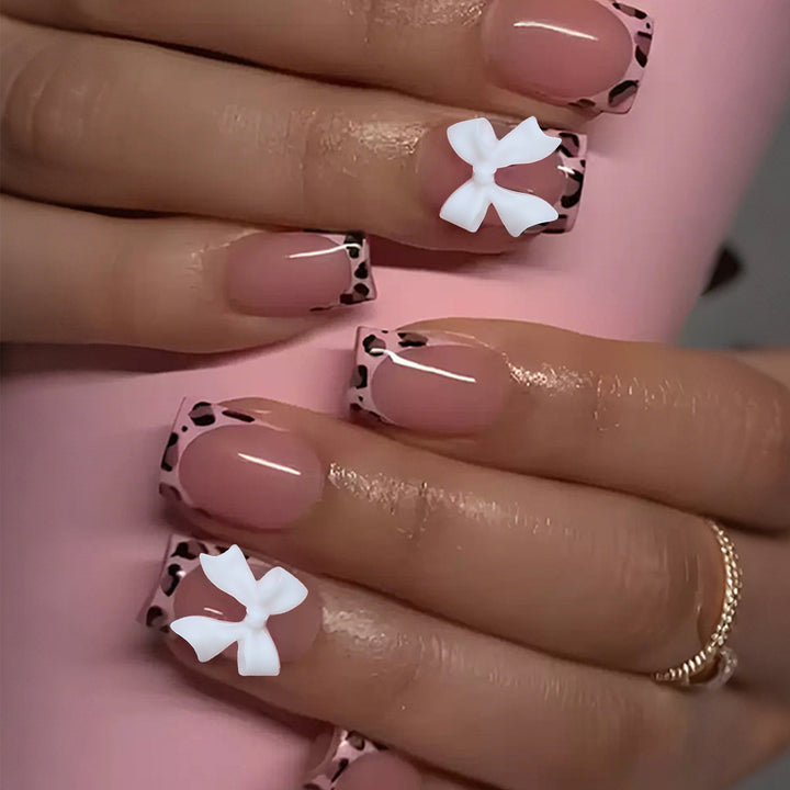 Artificial nail set with delicate bow and leopard patterns Bowlift