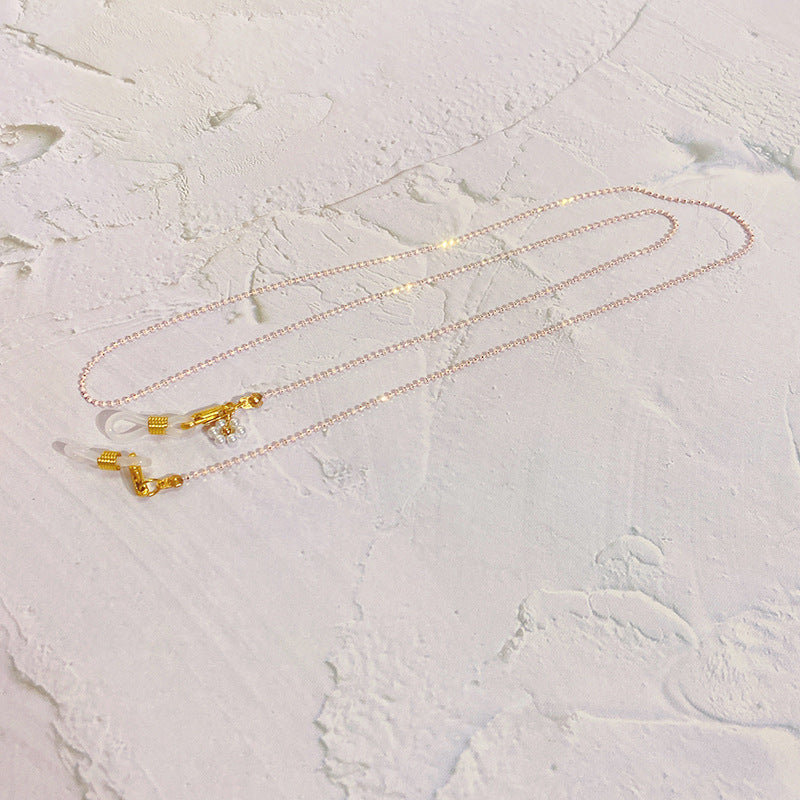 Eyewear chain with pearls and gold pendants Bowlift
