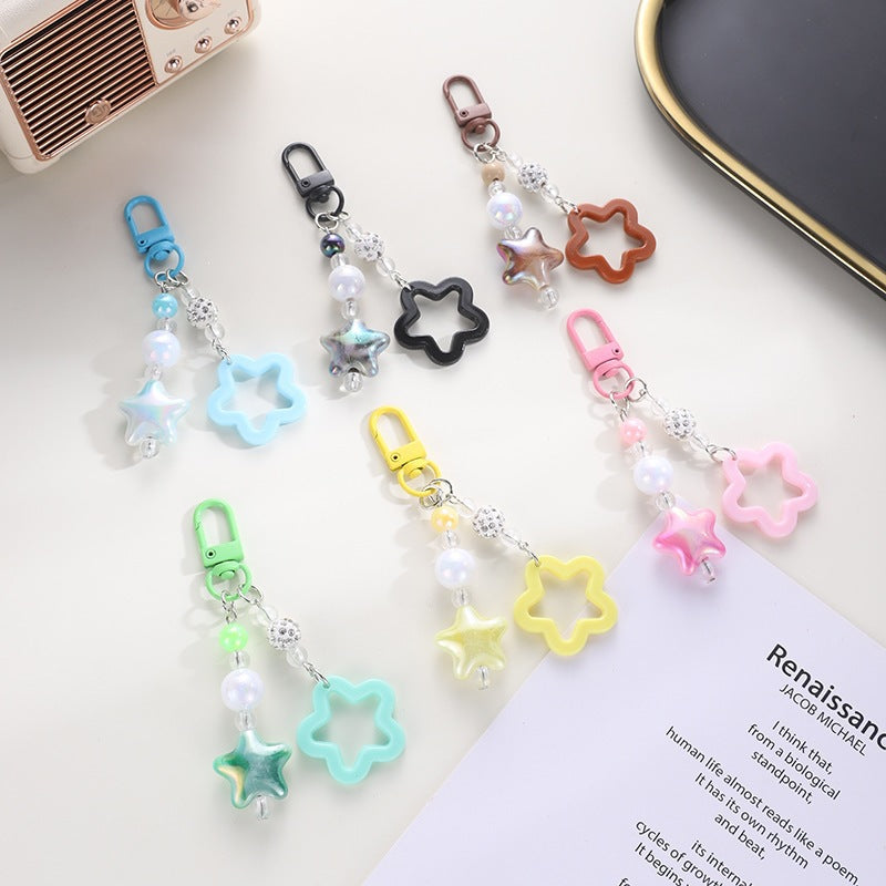 Playful keychain with floral and star motif Bowlift