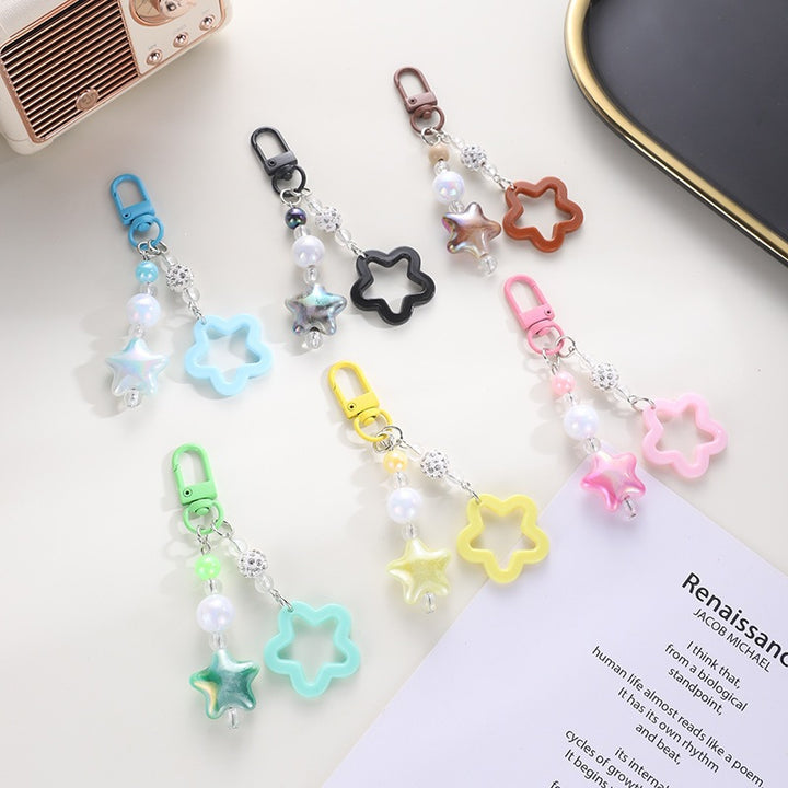 Playful keychain with floral and star motif Bowlift
