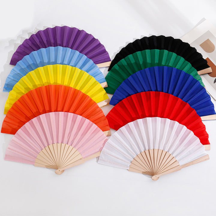 Ladies folding hand fan made of airy material with intricate folds Bowlift