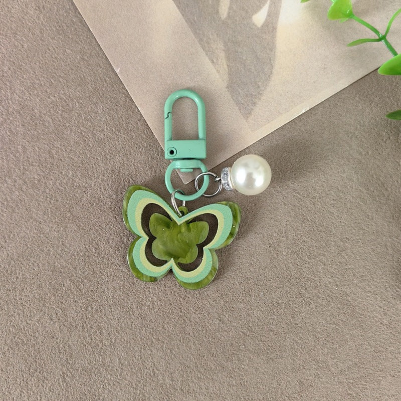Keychain with butterfly and pearl accent Bowlift