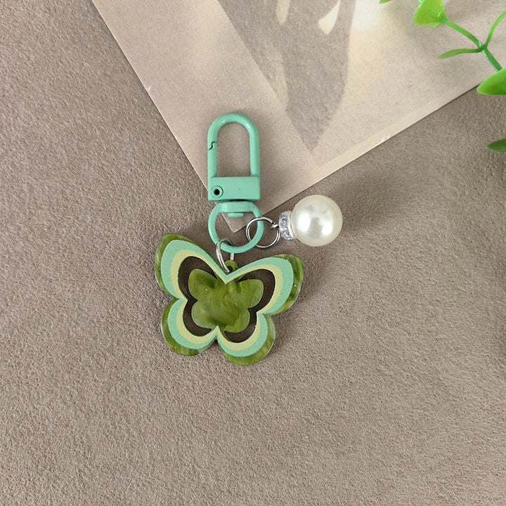 Keychain with butterfly and pearl accent Bowlift