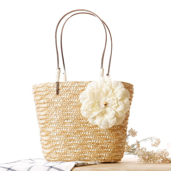 Beach bag with decorative flower detail embellishment Bowlift