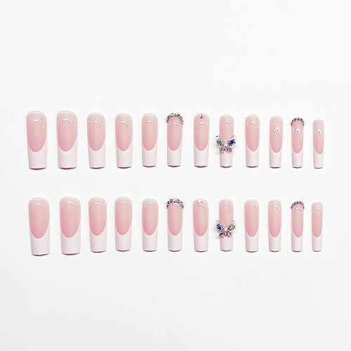 Acrylic nail set with elegant design and sparkling rhinestone accents Bowlift